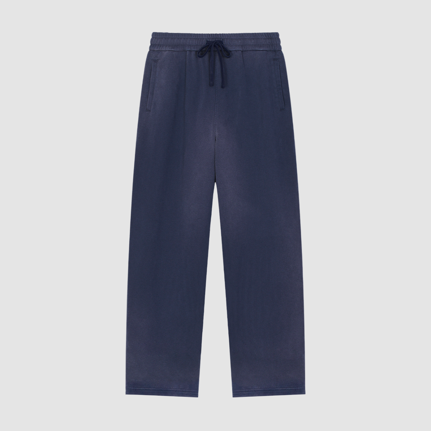 Navy blue pants with a drawstring on a white background