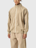 Beige tracksuit with white stripes on a white background