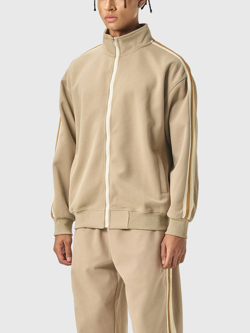 Beige tracksuit with white stripes on a white background